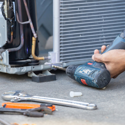 HVAC unit being repaired