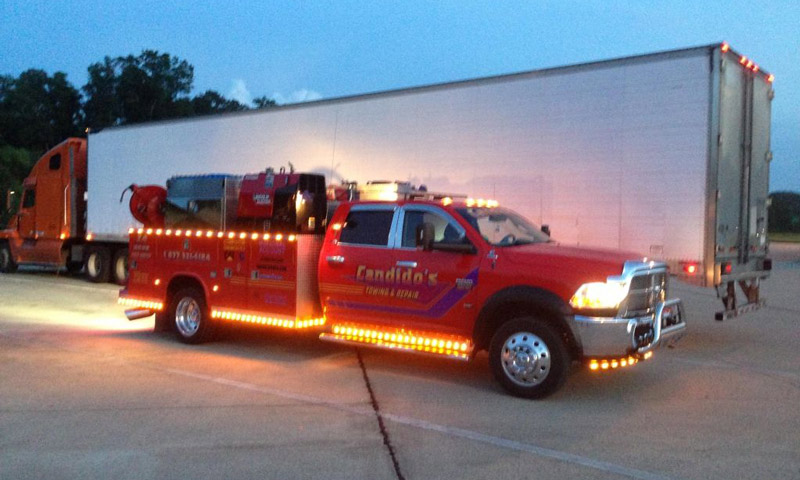 red service truck with external decorative lighting