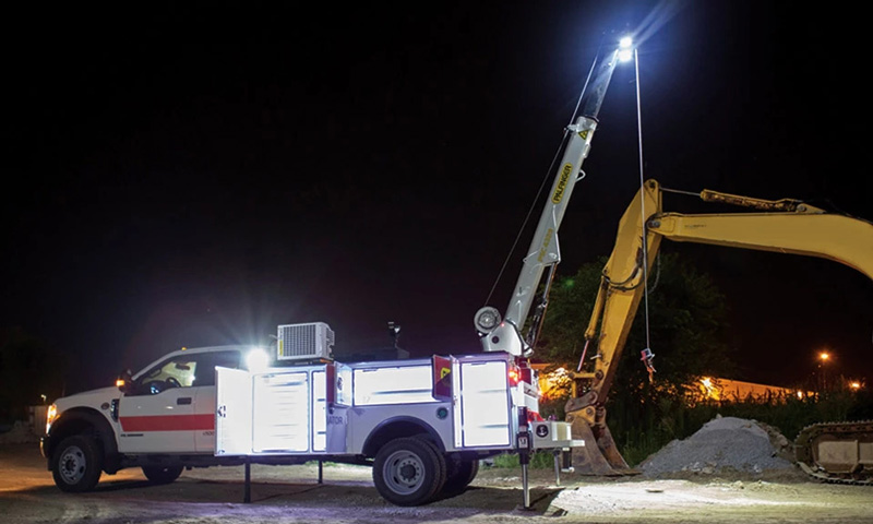 service truck with a floodlight on the boom tip