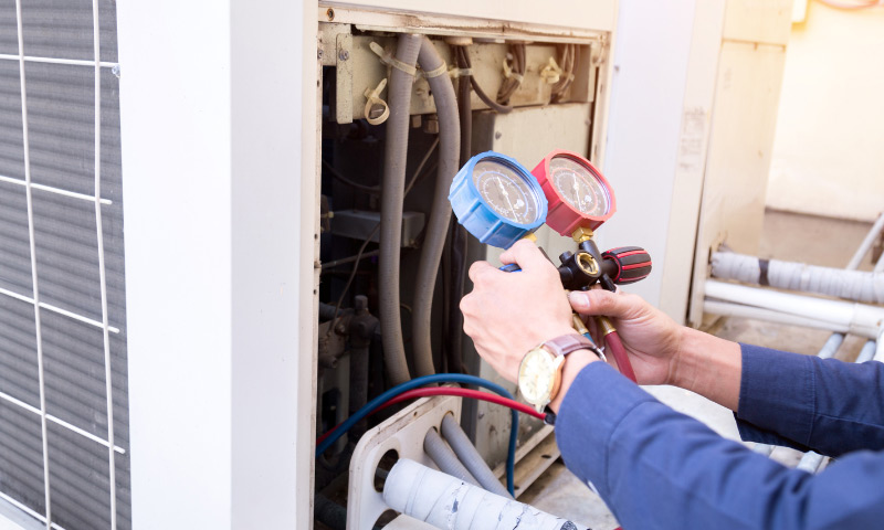 technician checking air conditioner