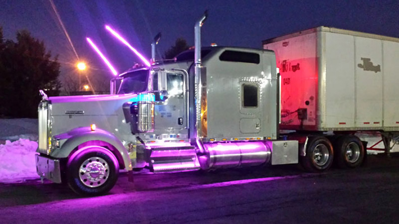 white service truck with external decorative lighting