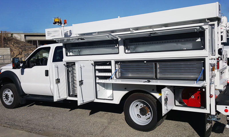 white service truck with multiple storage areas