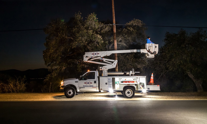 white service truck with underbody lighting