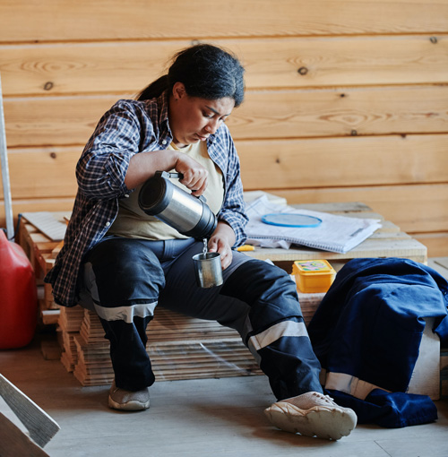 worker pouring a beverage during breaktime